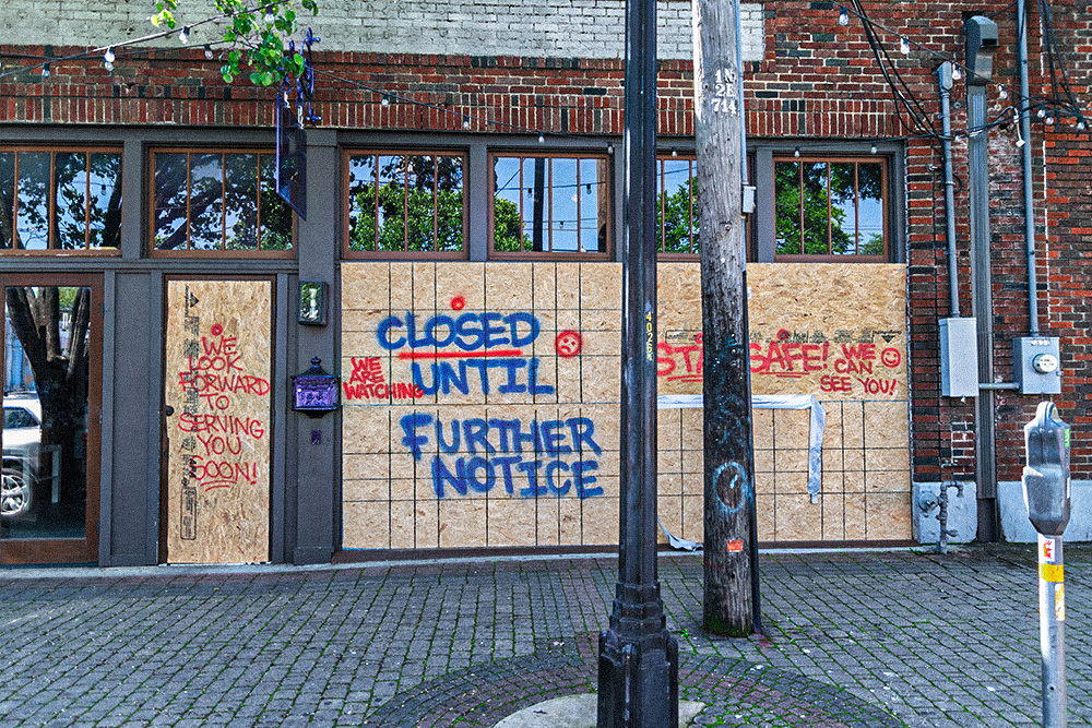 a boarded up and abandoned downtown street