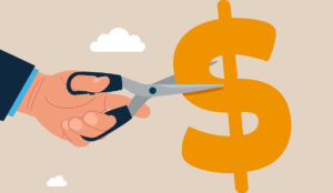 Budget cuts graphic of a hand with scissors cutting a dollar sign